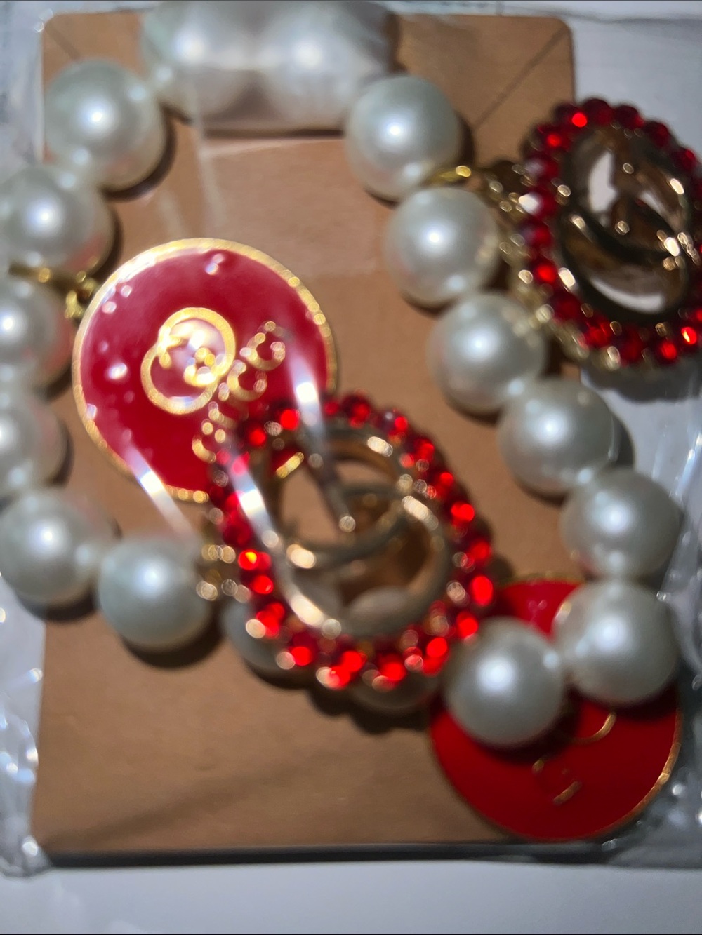 Pearl Bracelet with Red Crystal Charms and Gold Hardware